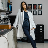 Woman in a lab jacket modeling the The Dorothy™ Top 2.0